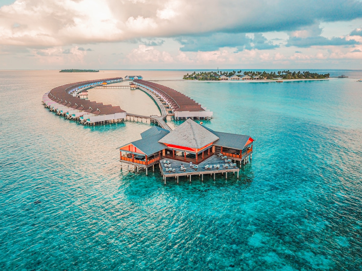 Maldives overwater resort at sunset